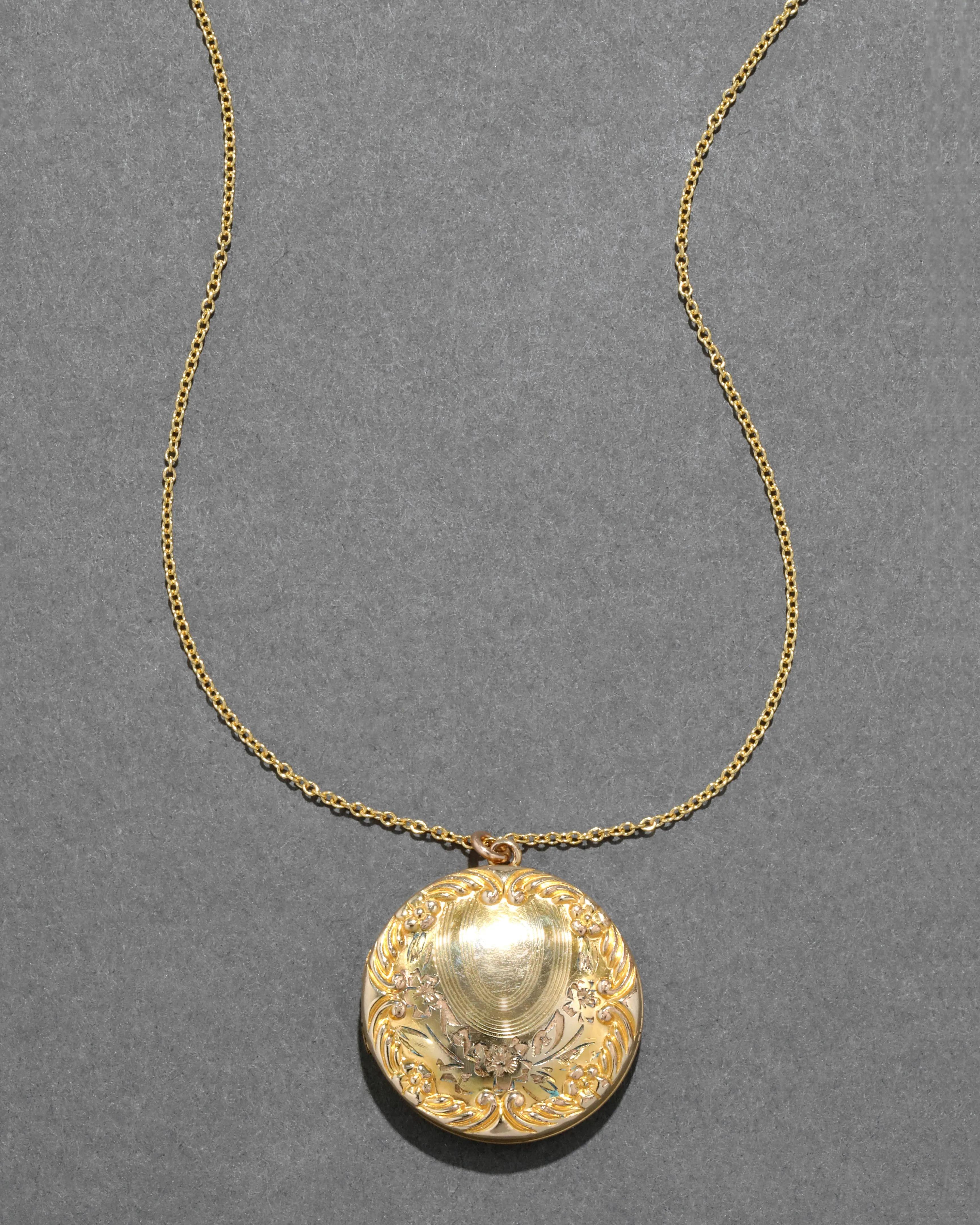 Antique 1920s 14k Gold Fill Hand Etched Floral Locket Necklace sold by Alexis Bittar