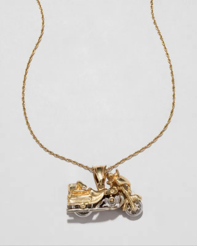 Vintage 1970s 14k Two Tone Gold Articulated Motorcycle Pendant Necklace sold by Alexis Bittar