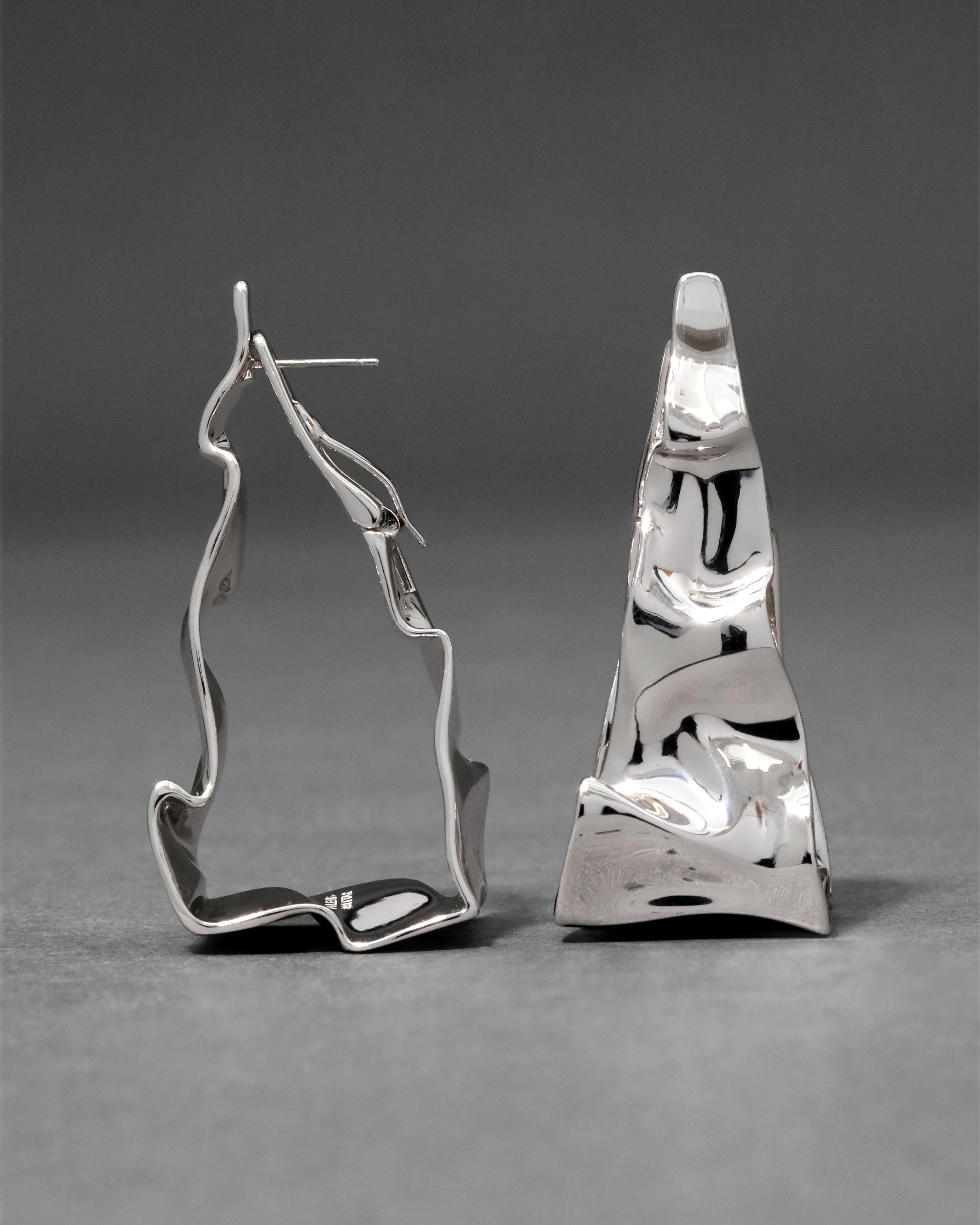 Crumpled Silver Tapered Hoop Earring sold by Alexis Bittar