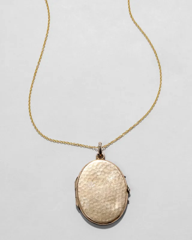 Antique 1910s 14k Gold Filled Hammered Oval Locket Necklace sold by Alexis Bittar