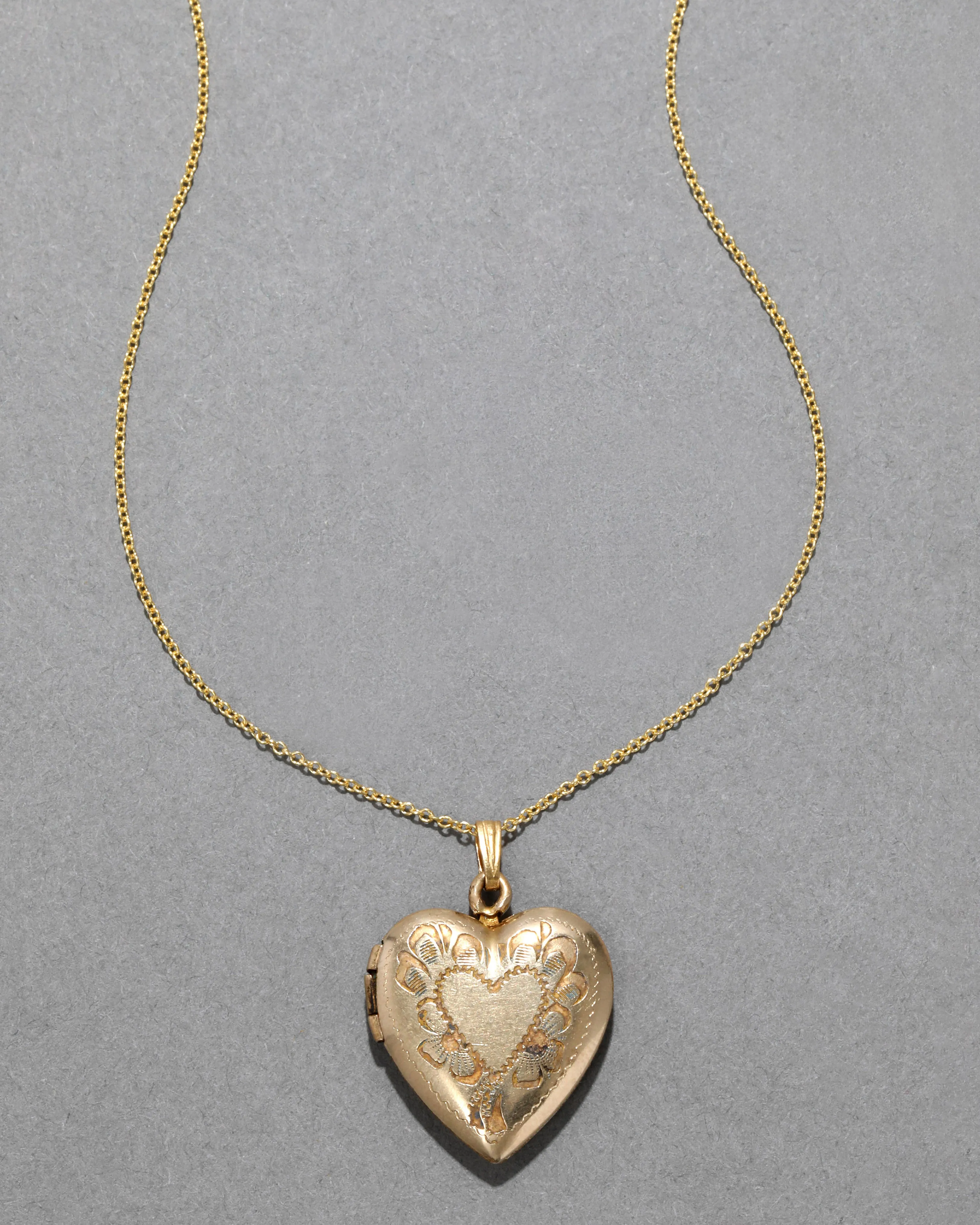 Vintage 1940s 14k Gold Filled Floral Heart Motif Heart Shaped Locket Necklace sold by Alexis Bittar