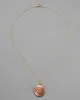 Vintage 1950s 10k Gold Filled Rose Colored Etched Circle Locket Necklace sold by Alexis Bittar