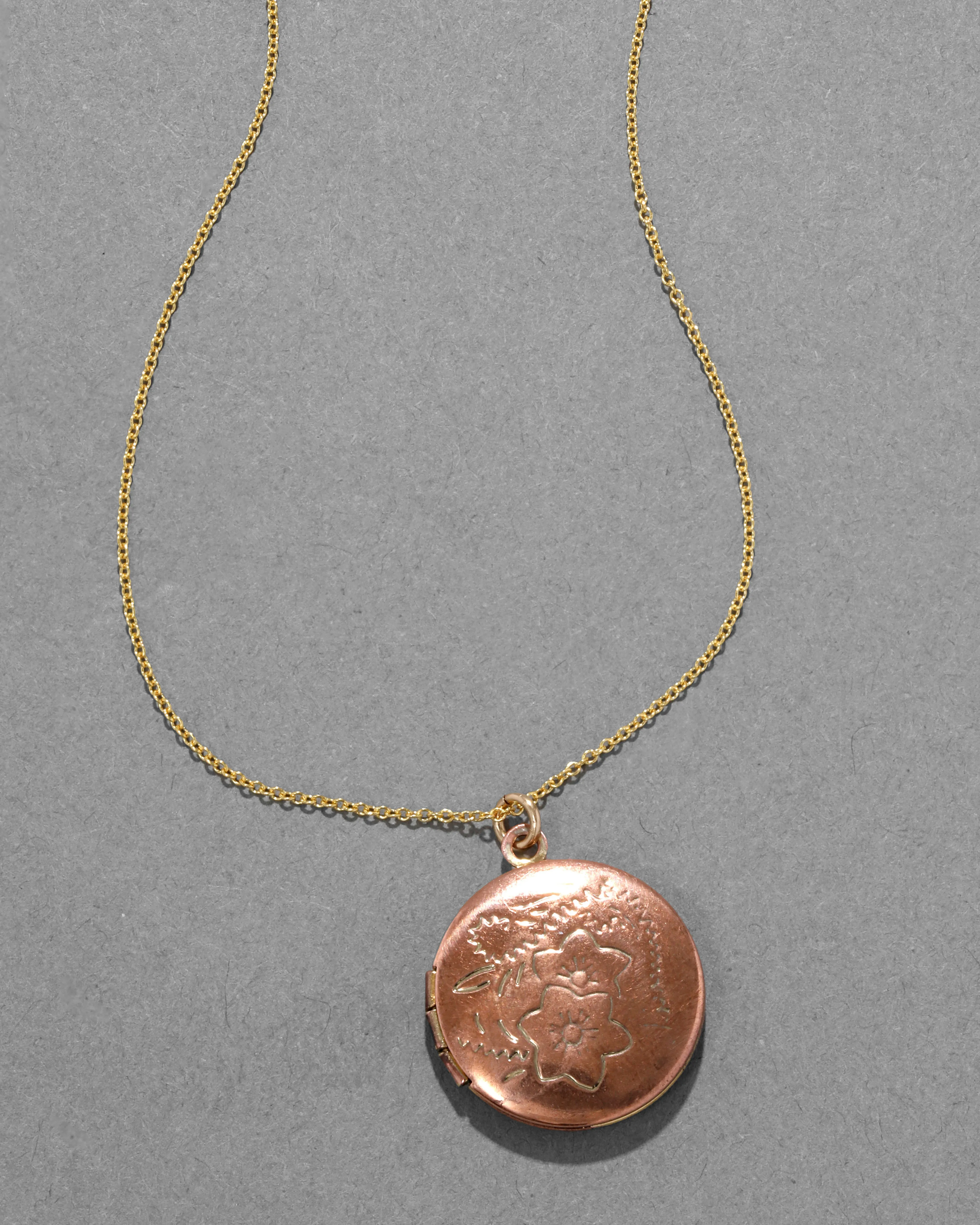 Vintage 1950s 10k Gold Filled Rose Colored Etched Circle Locket Necklace sold by Alexis Bittar