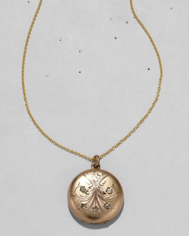 Antique 1910s 14k Gold Filled Crystal Set Flower Circle Locket Necklace sold by Alexis Bittar