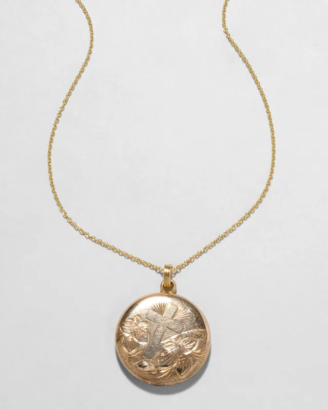 Vintage 1940s 14k Gold Filled Etched Circle Locket Necklace sold by Alexis Bittar
