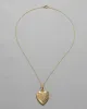 Vintage 1940s 12k Gold Filled Etched Floral Frame Design Heart Locket Necklace sold by Alexis Bittar