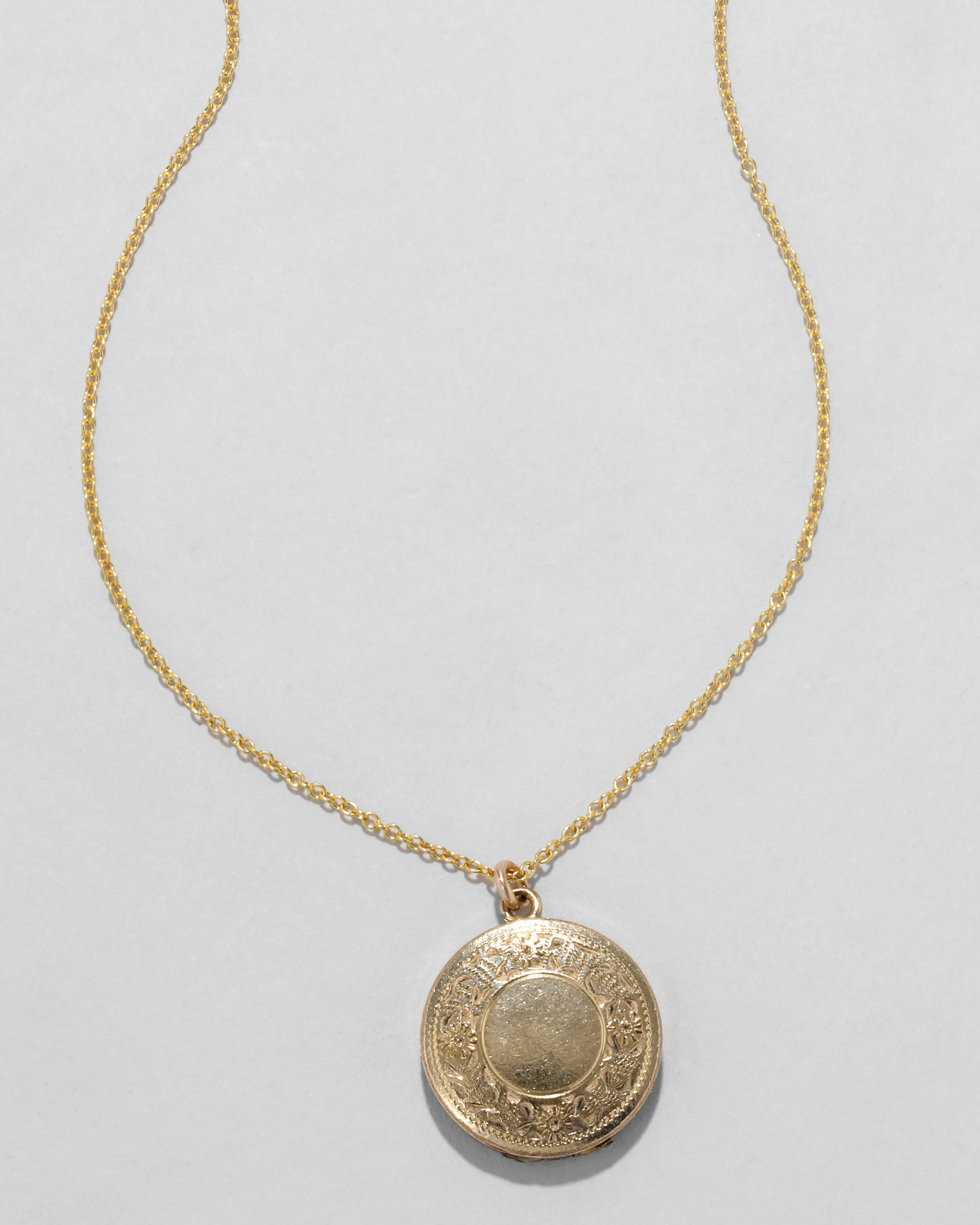 Antique 1920s 14k Gold Filled Circular Floral Pattern Locket Necklace sold by Alexis Bittar