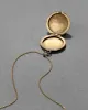 Antique 1800s 14k Gold Filled Floral Etched Circle Locket Necklace sold by Alexis Bittar