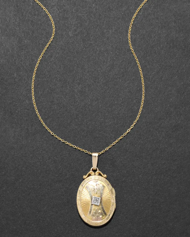 Antique 1920s 10k Gold Filled Two Tone Etched with Diamond Chip Oval Locket Necklace sold by Alexis Bittar