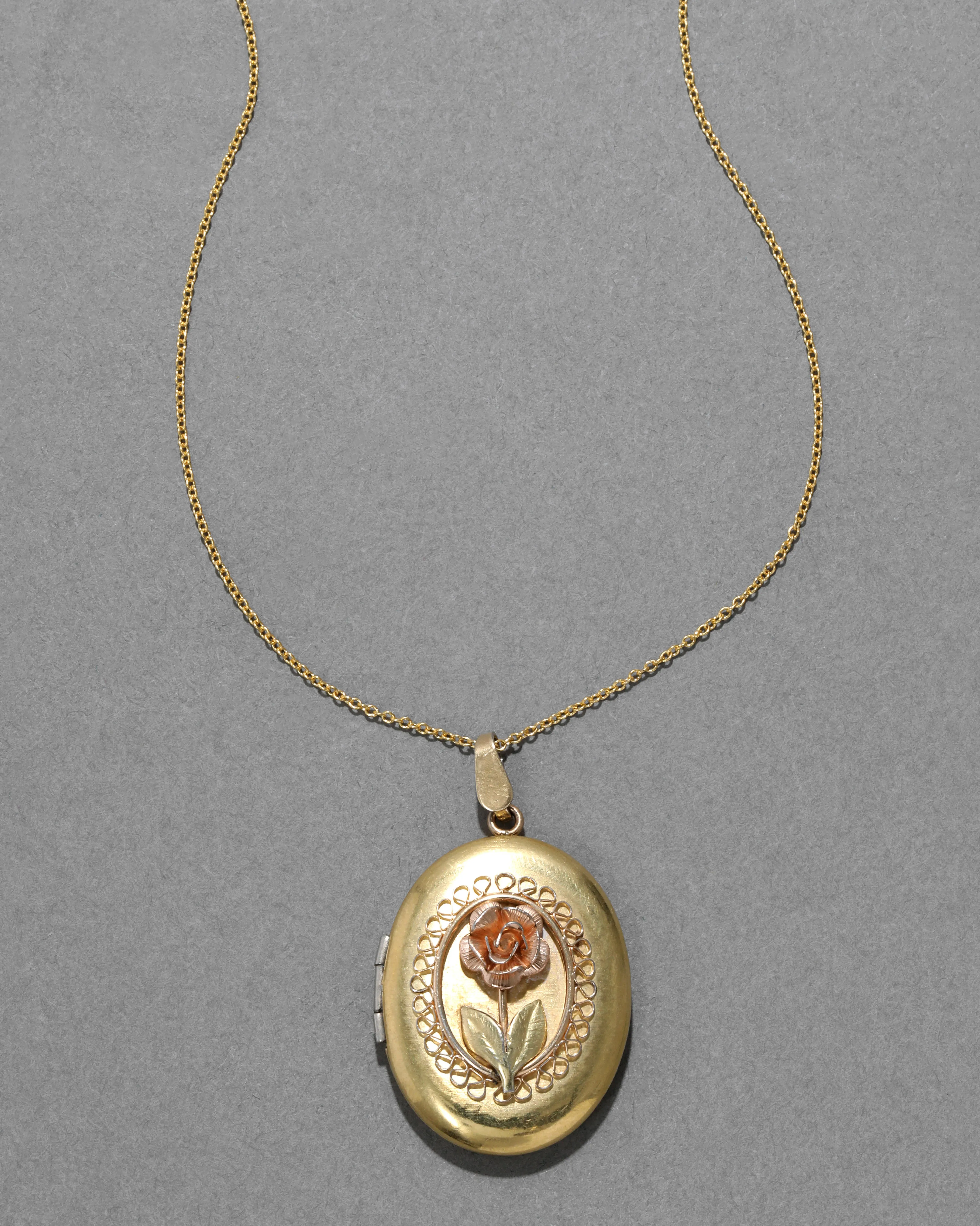Vintage 1950s 14k Gold Filled 3D Rose Oval Locket Necklace sold by Alexis Bittar