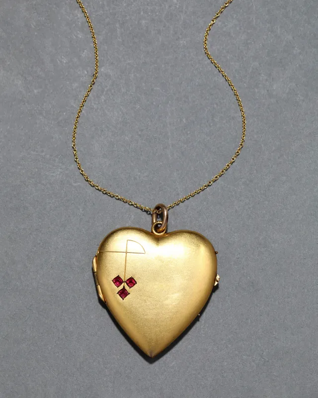 Antique 1910s 14k Gold Fill Garnet Motif Heart Locket Necklace sold by Alexis Bittar