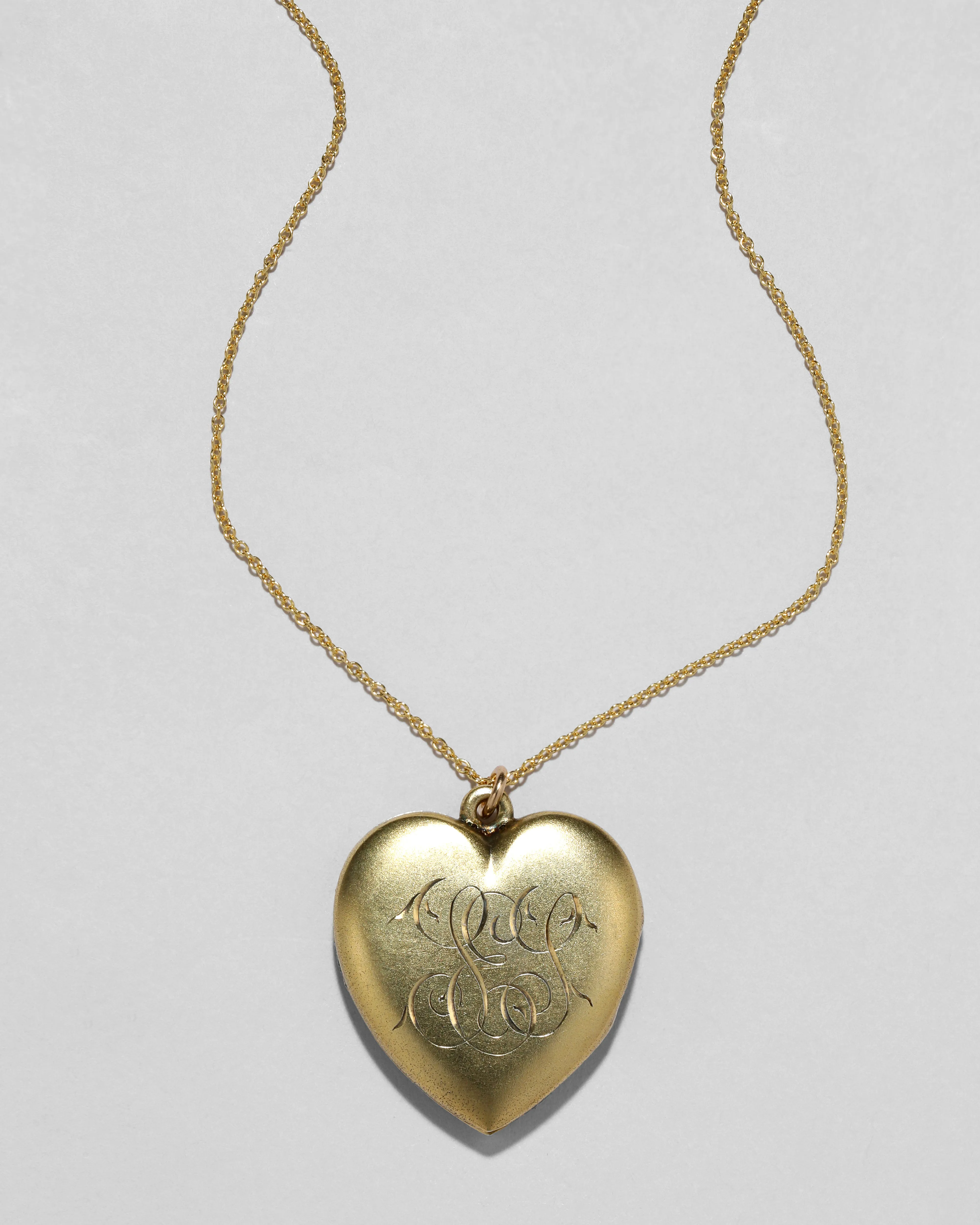 Antique 1900s Gold Plated Sterling Silver Hand Etched Heart Locket Necklace sold by Alexis Bittar