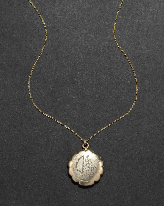 Antique 1920s 12k Gold Filled Etched Floral and Scalloped Edge Locket Necklace sold by Alexis Bittar