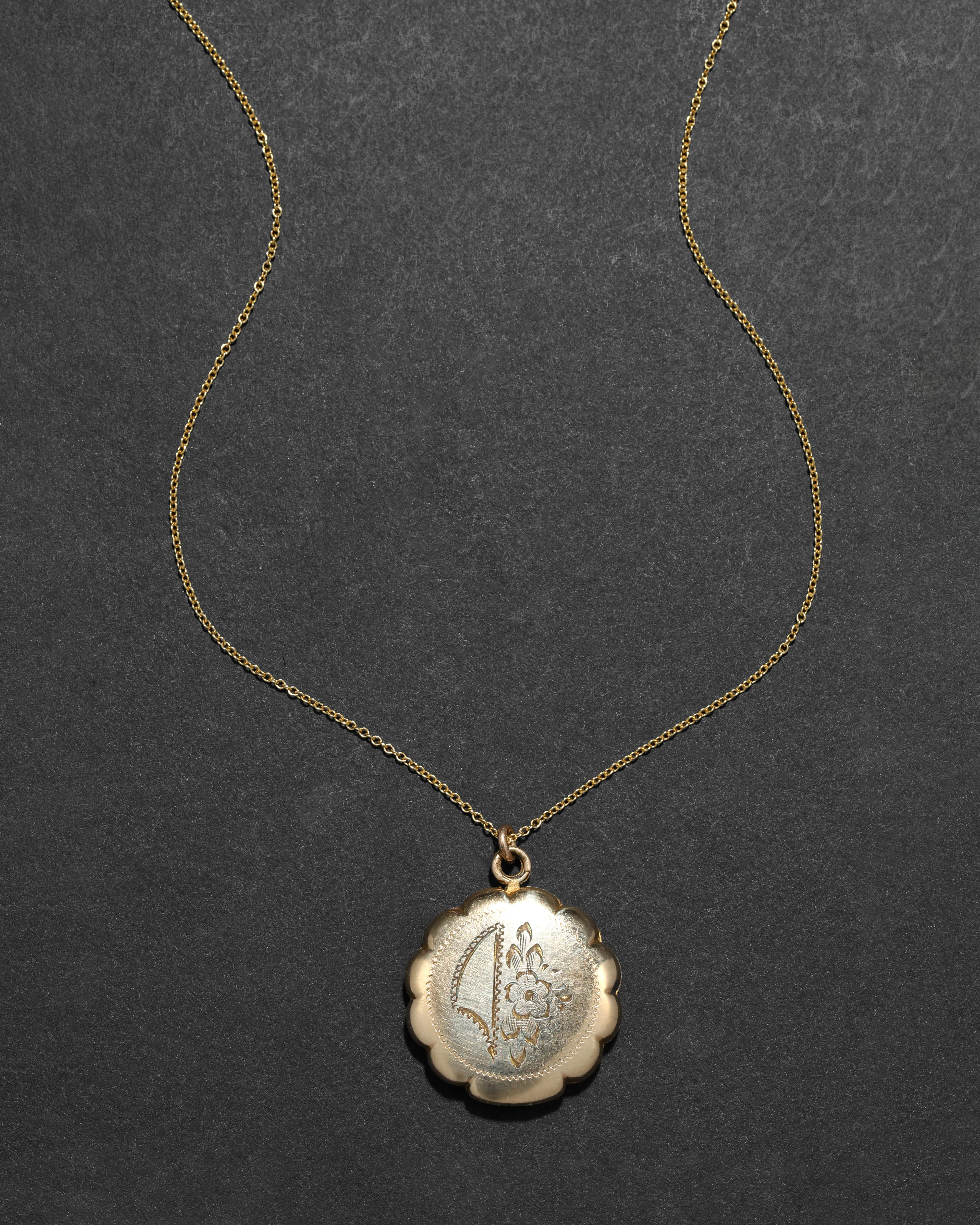 Antique 1920s 12k Gold Filled Etched Floral and Scalloped Edge Locket Necklace sold by Alexis Bittar