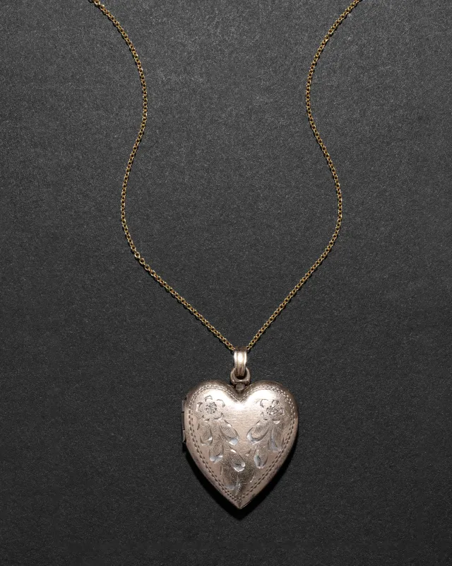 Vintage 1940s 12k Gold Filled over Silver Etched Heart Locket Necklace sold by Alexis Bittar
