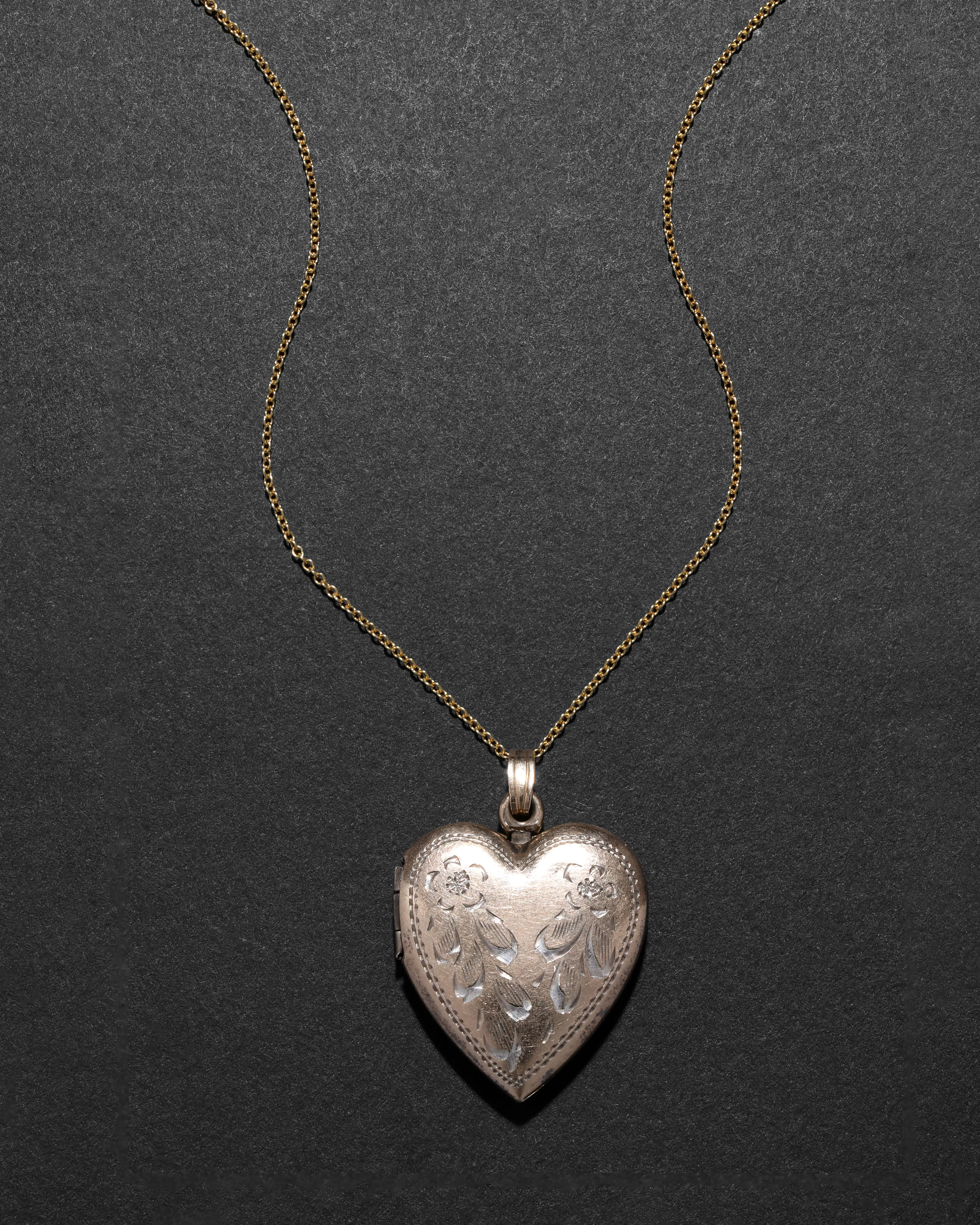 Vintage 1940s 12k Gold Filled over Silver Etched Heart Locket Necklace sold by Alexis Bittar