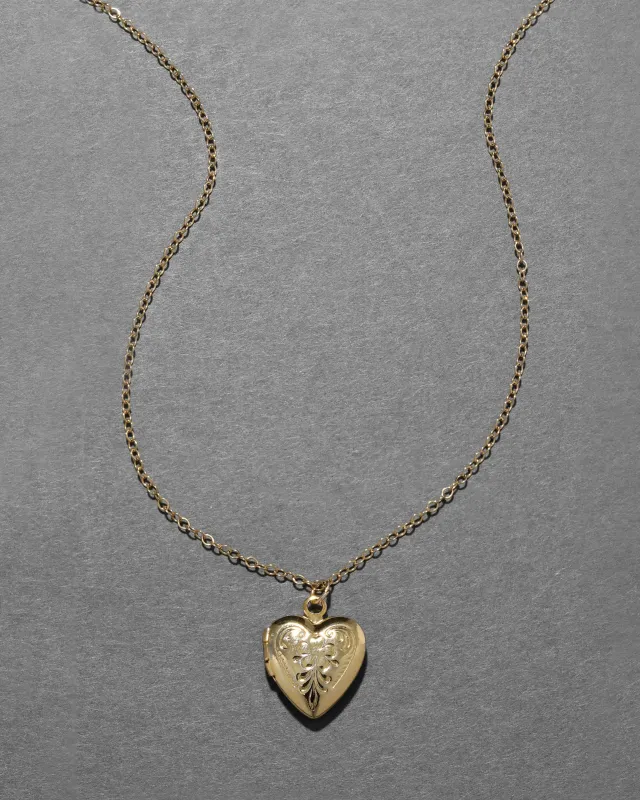 Vintage 1940s 12k Gold Fill Etched Small Heart Locket Necklace sold by Alexis Bittar