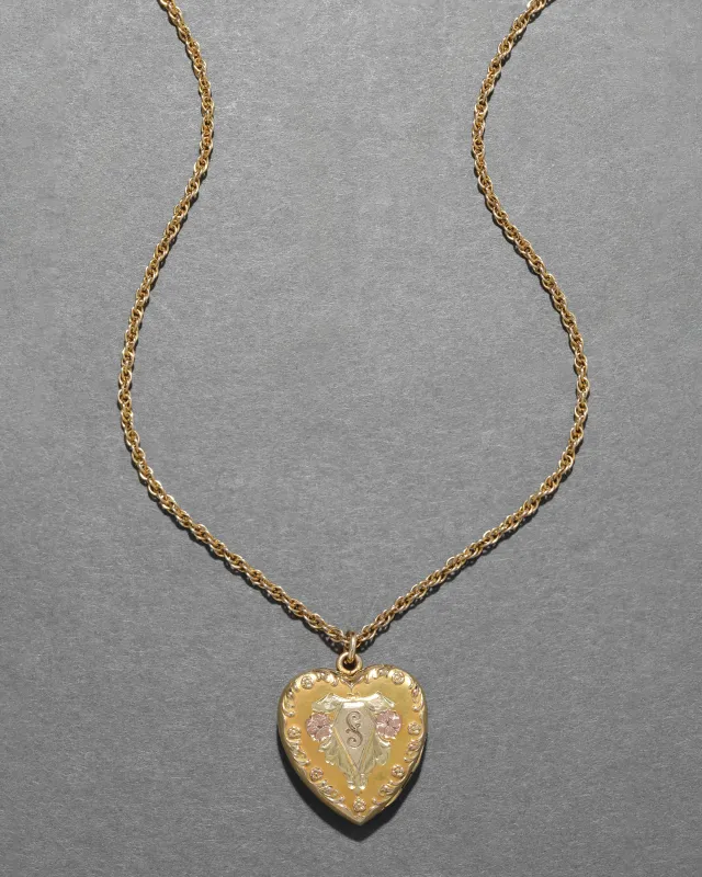 Antique 1920s 14k Tri-Color Gold Heart Locket Necklace sold by Alexis Bittar