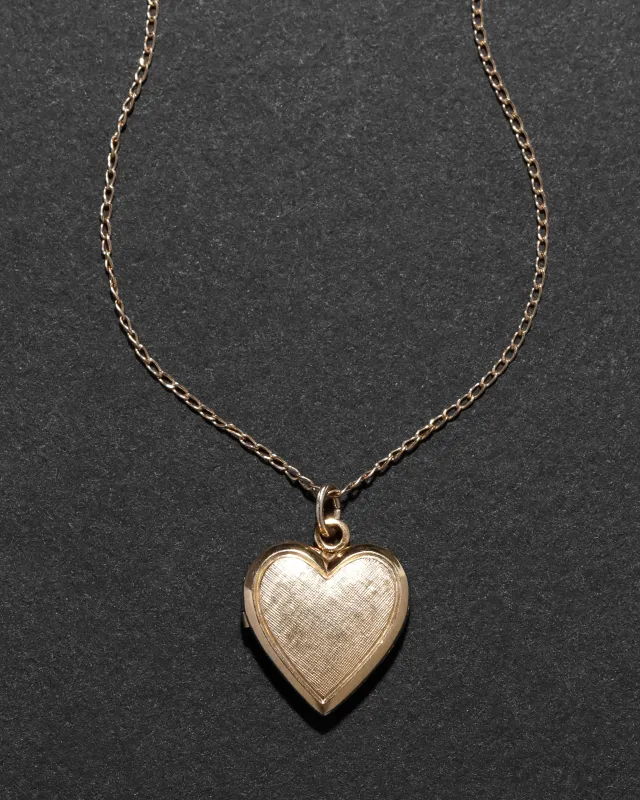 Vintage 1960s 14k Gold Fill Hand Etched Heart Locket Necklace sold by Alexis Bittar
