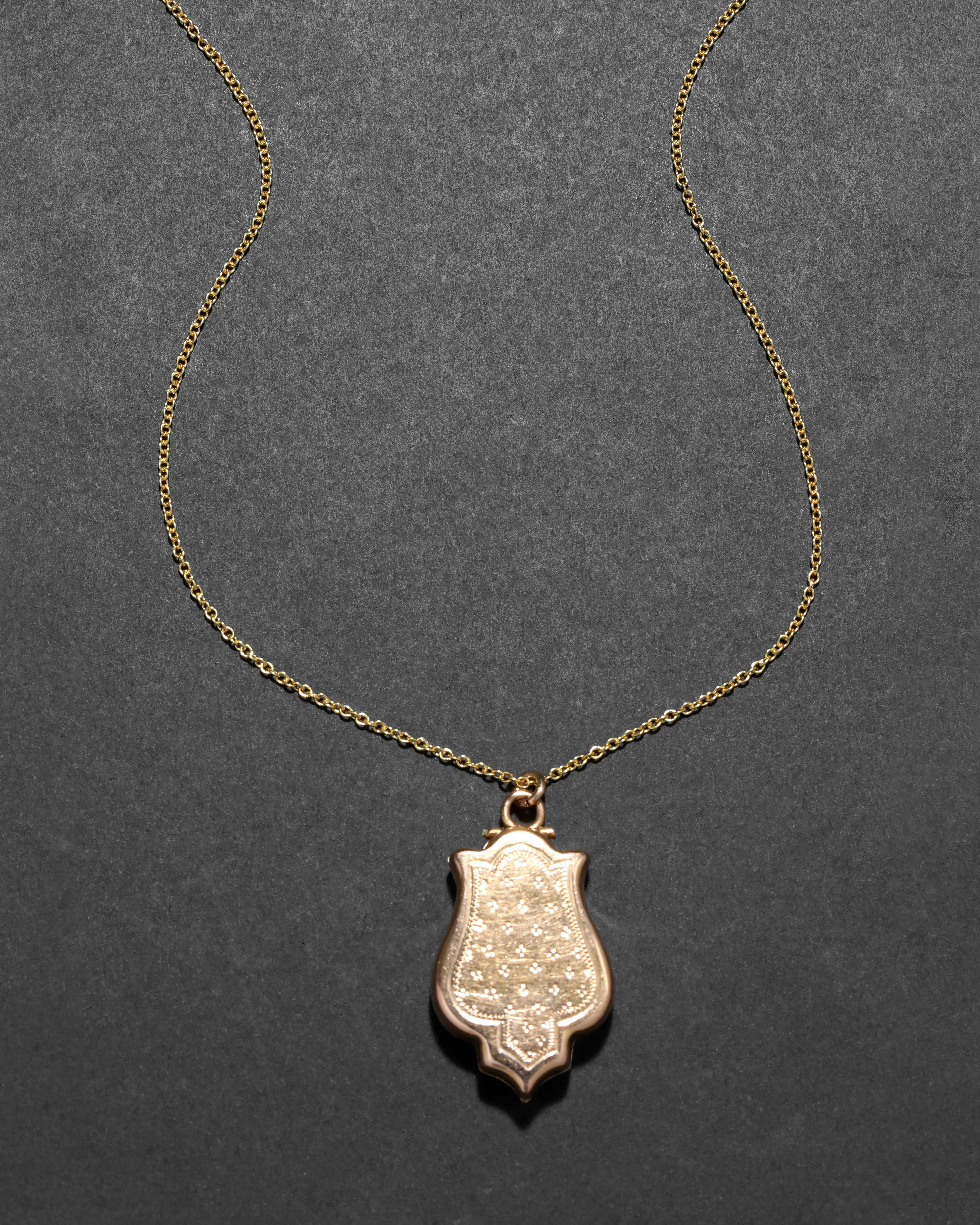 Antique 1910s 14k Gold Hand Etched Unique Shape Locket Pendant Necklace sold by Alexis Bittar