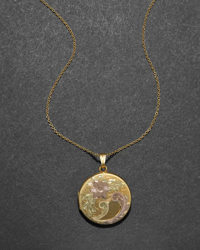 Vintage 1960s 12k Gold Filled Three Tone Floral Etched Locket Necklace sold by Alexis Bittar