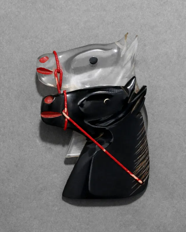 Vintage 1930s Bakelite & Lucite Hand Carved Double Horse Pin sold by Alexis Bittar