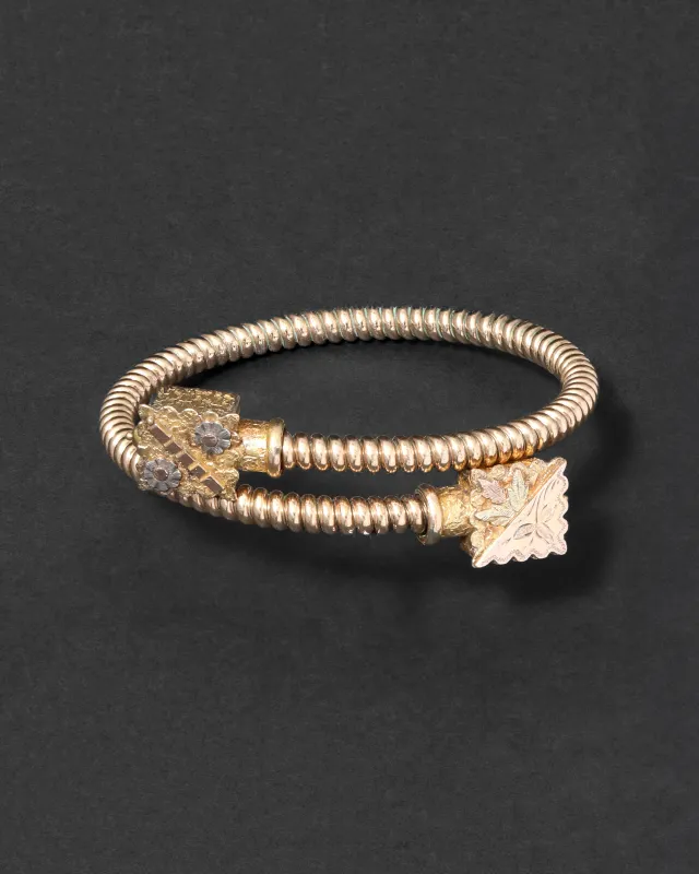 Antique 1800s 14k Tricolor Gold Fill Coil Bracelet with Hand Engraved End Caps sold by Alexis Bittar