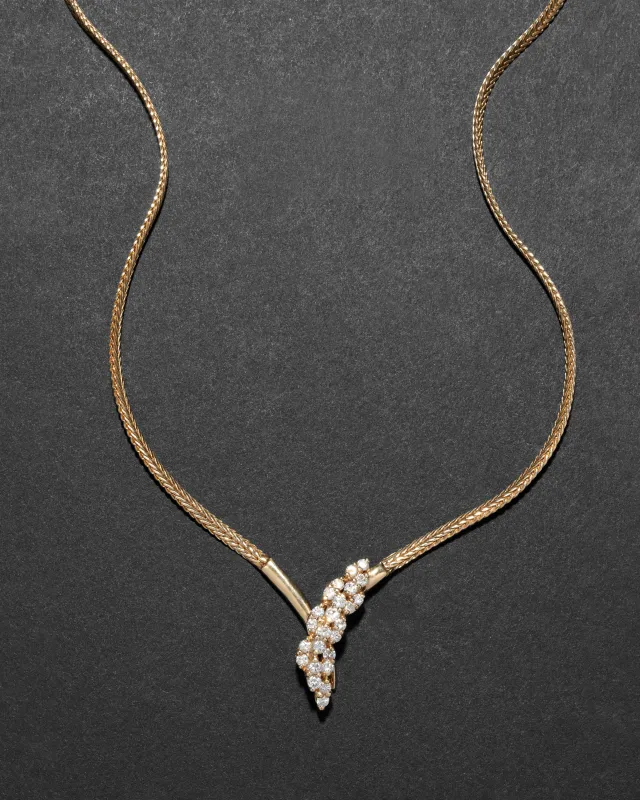 Vintage 1980s 14k Gold with Diamond Snake Head with Gold Tipped Tail Pendant Necklace sold by Alexis Bittar