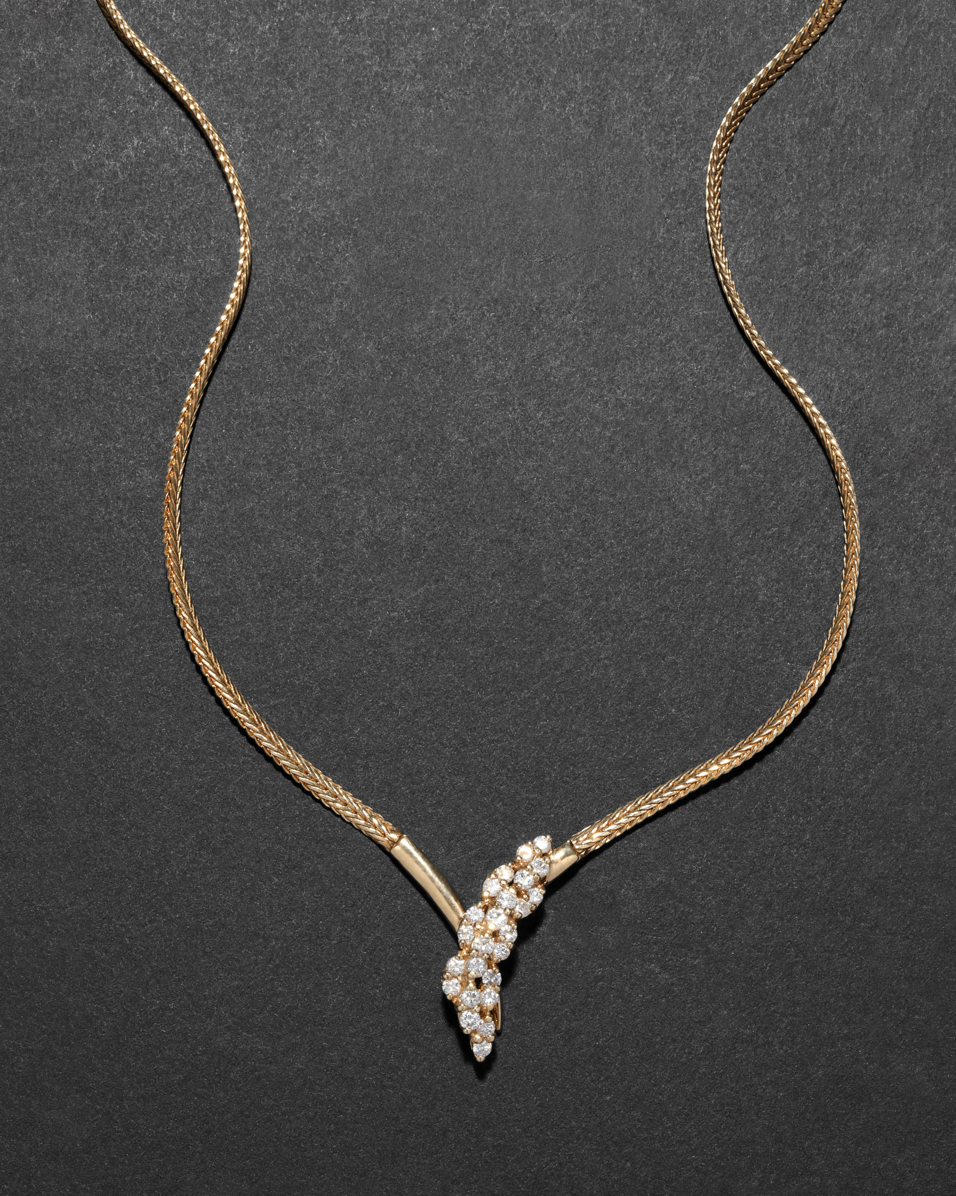 Vintage 1980s 14k Gold with Diamond Snake Head with Gold Tipped Tail Pendant Necklace sold by Alexis Bittar
