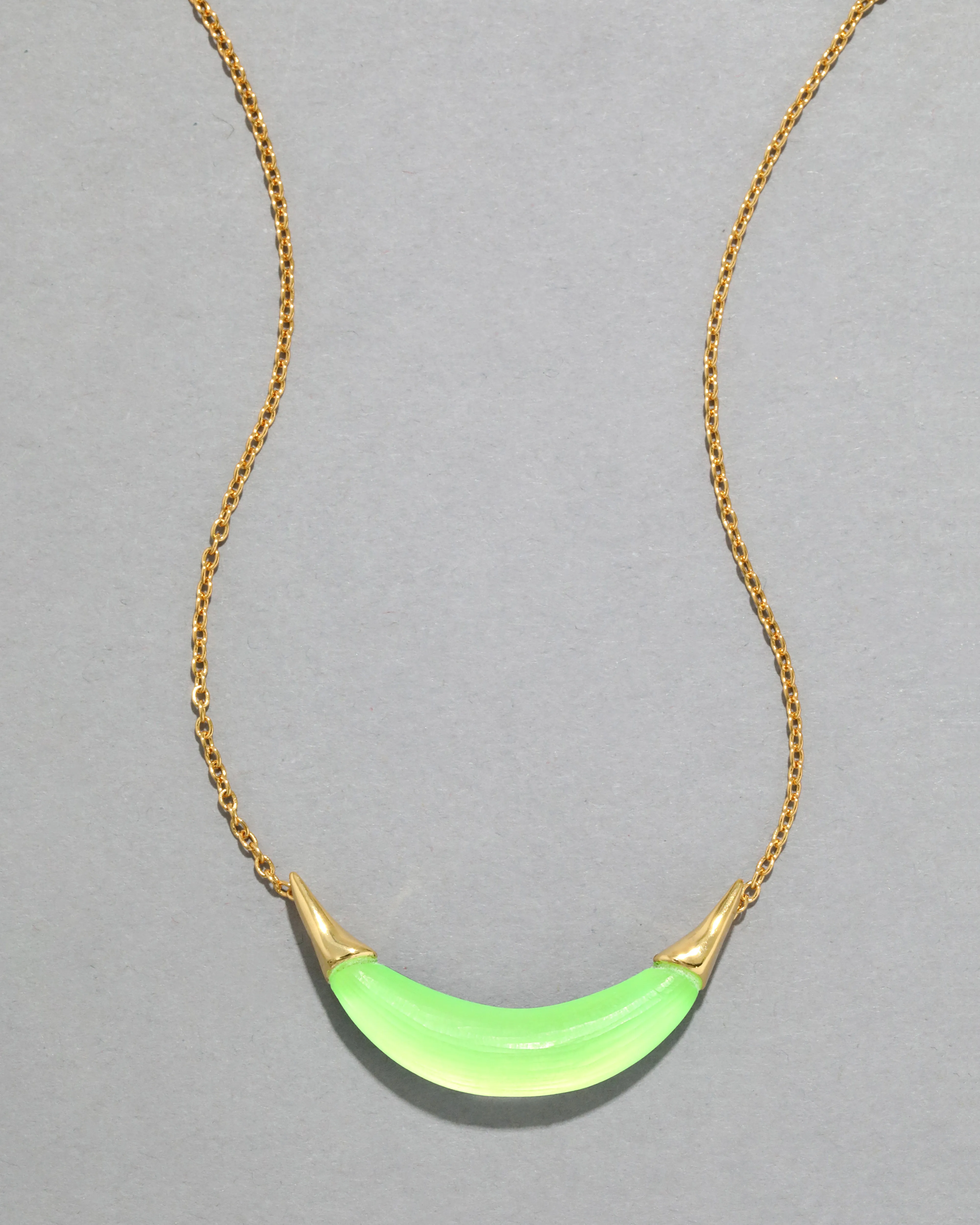 Gold Capped Crescent Lucite Necklace- Neon Green sold by Alexis Bittar