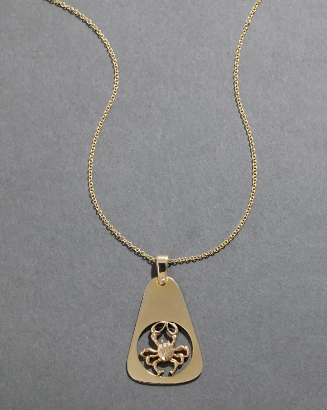 Vintage 1970s 14k Gold Cancer Zodiac Pendant Necklace sold by Alexis Bittar