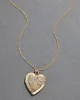 Vintage 1950s 12k Gold FIlled Engraved Heart Locket Necklace sold by Alexis Bittar