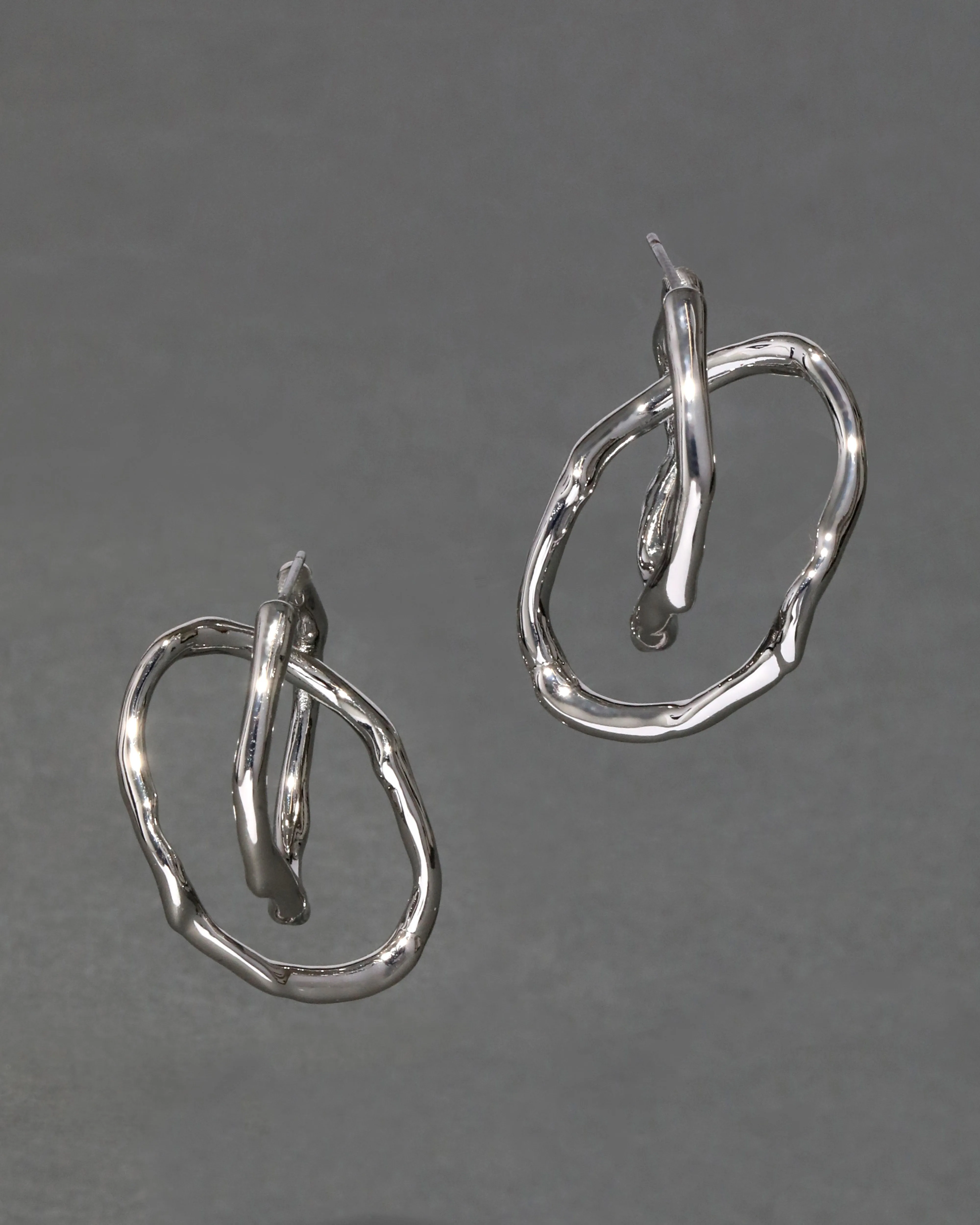Twisted Silver Interlock Hoop Earring sold by Alexis Bittar