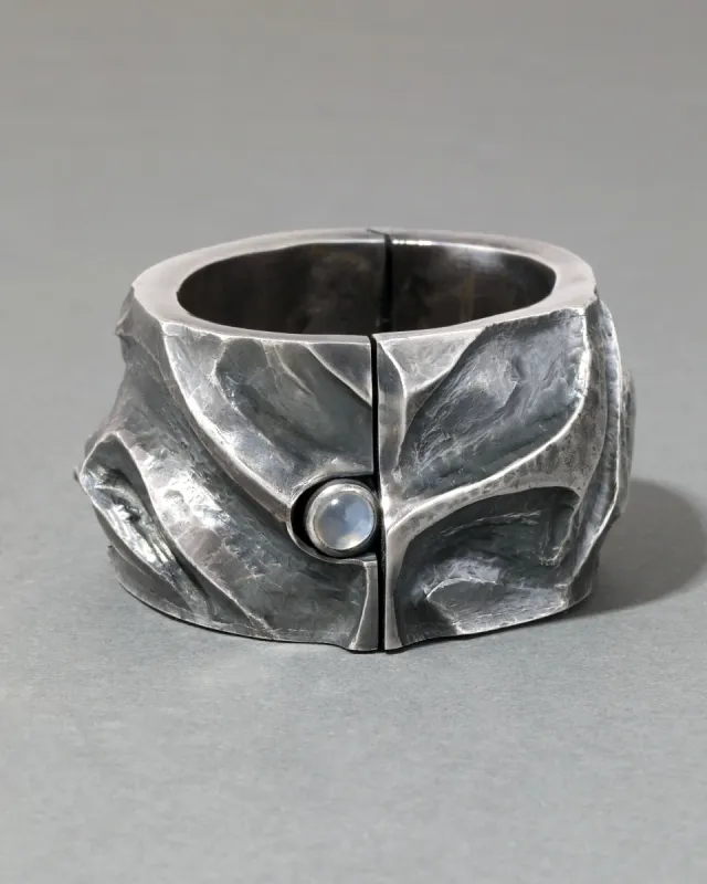 Vintage 1960s Sterling Silver Repousse & Moonstone Hinge Cuff Bracelet sold by Alexis Bittar