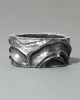 Vintage 1960s Sterling Silver Repousse & Moonstone Hinge Cuff Bracelet sold by Alexis Bittar