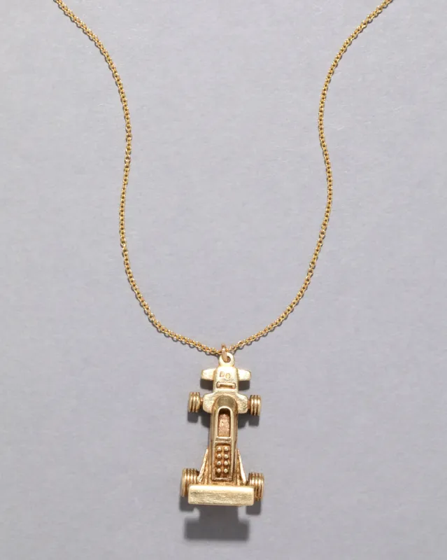 Vintage 1980s 14k Gold Car Pendant Necklace sold by Alexis Bittar