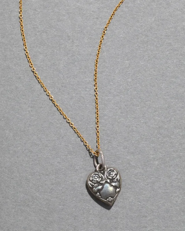 Sterling Silver Engraved Floral Heart Pendant Necklace sold by Alexis Bittar