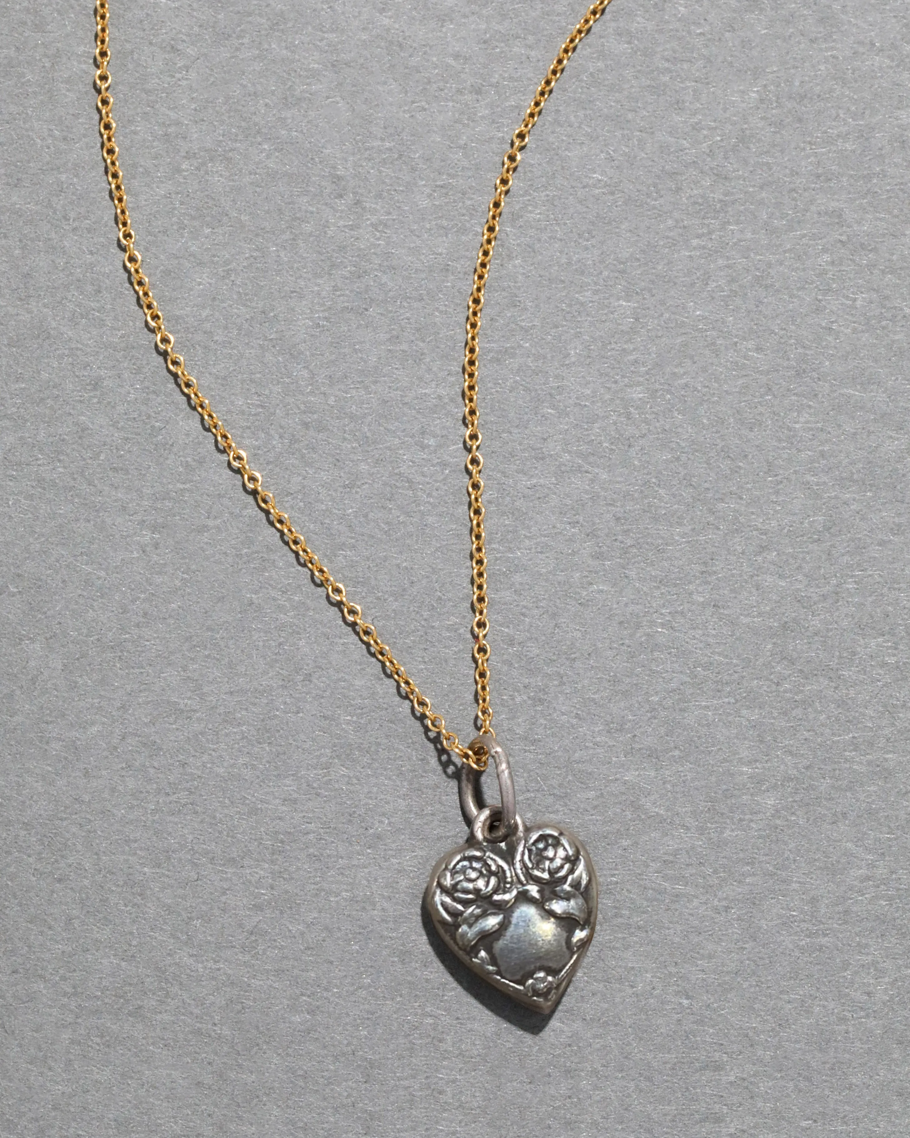 Sterling Silver Engraved Floral Heart Pendant Necklace sold by Alexis Bittar