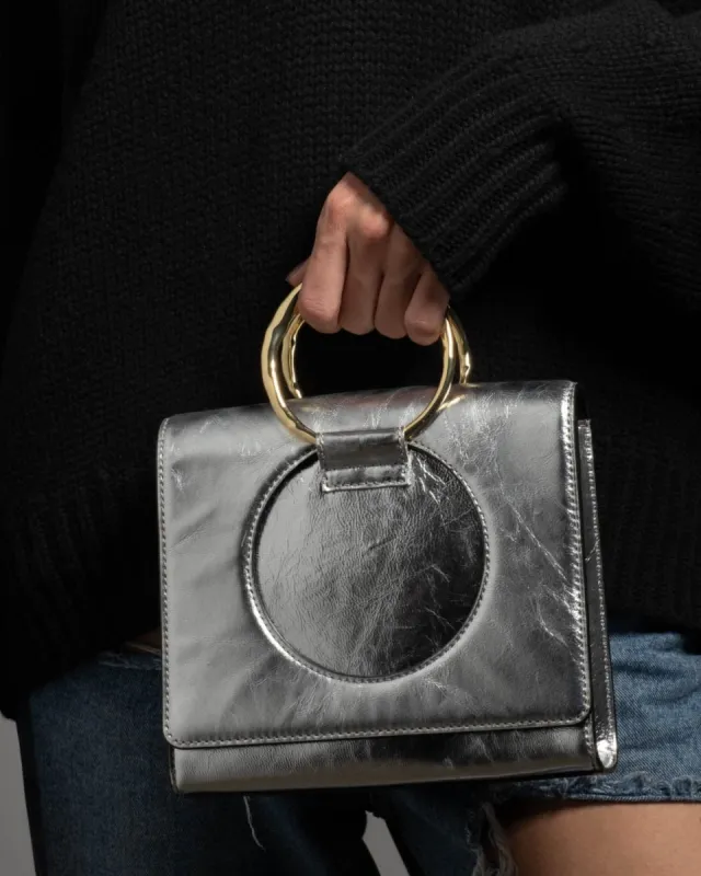 The Hunter Convertible Crossbody Bag- Silver sold by Alexis Bittar