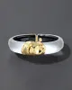 Molten Gold Lucite Hinge Bracelet- Silver sold by Alexis Bittar