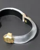 Molten Gold Lucite Hinge Bracelet- Silver sold by Alexis Bittar