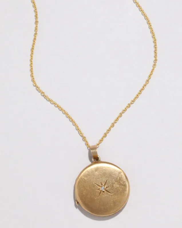 Antique 1920s 14k Gold Diamond Starburst Locket Necklace sold by Alexis Bittar