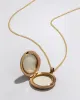Antique 1920s 14k Gold Diamond Starburst Locket Necklace sold by Alexis Bittar