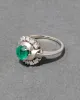 Vintage 1950s 14k White Gold Emerald & Diamond Halo Ring sold by Alexis Bittar