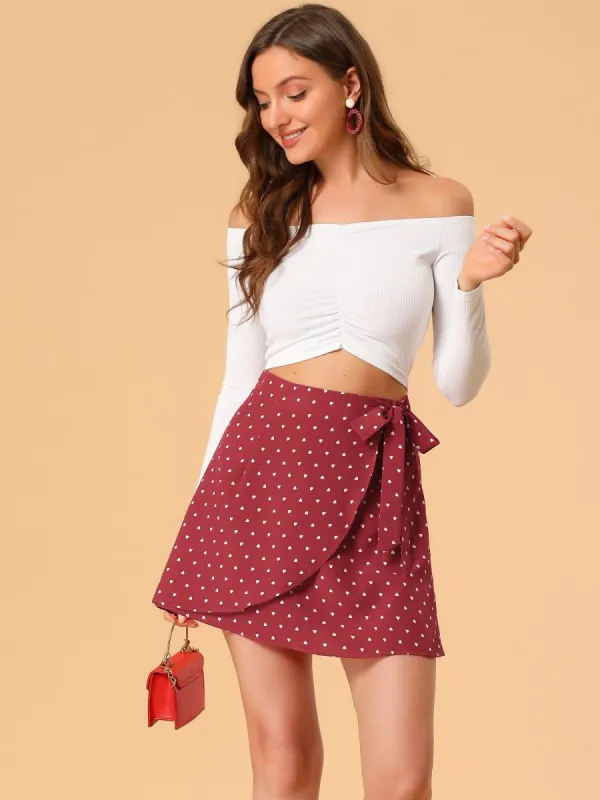 Asymmetrical Bow Tie Waist A-Line Heart Printed Wrap Mini Skirt sold by Allegra K