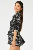 Black Abstract Oversized Playsuit sold by Ally Fashion