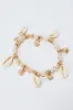 Gold Shell Charm Bracelet sold by Ally Fashion