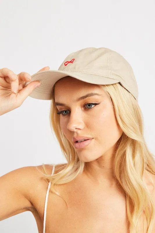 Beige Bow Cap sold by Ally Fashion