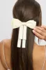 White Bow Hair Clip sold by Ally Fashion
