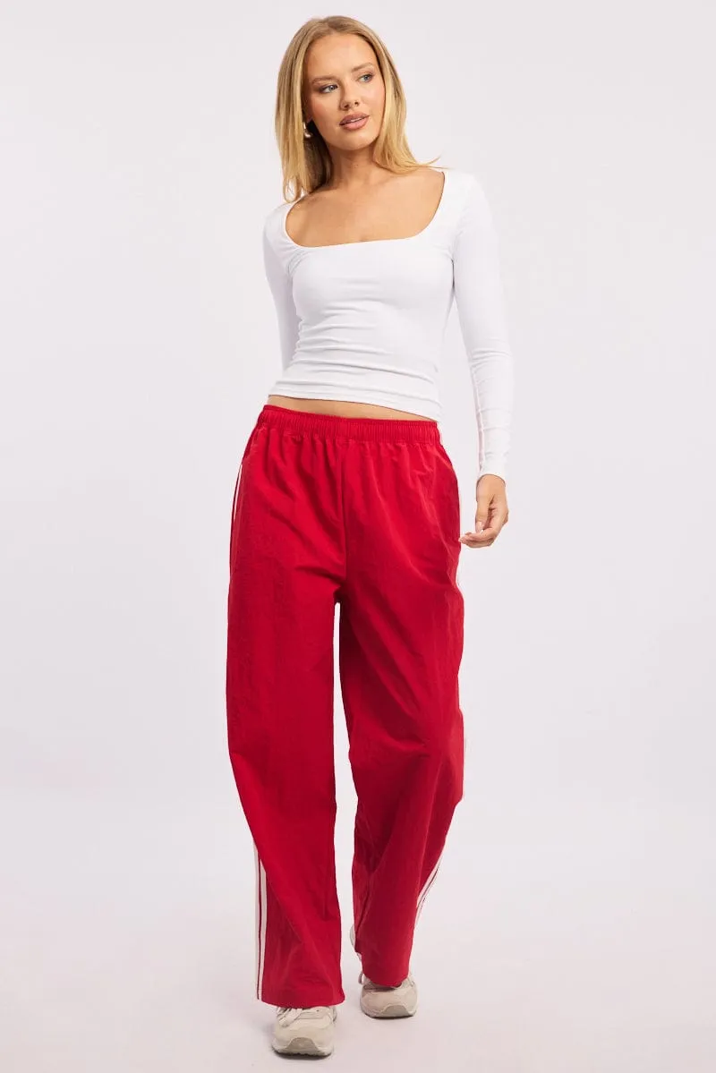 Red Track Pants Side Stripe sold by Ally Fashion